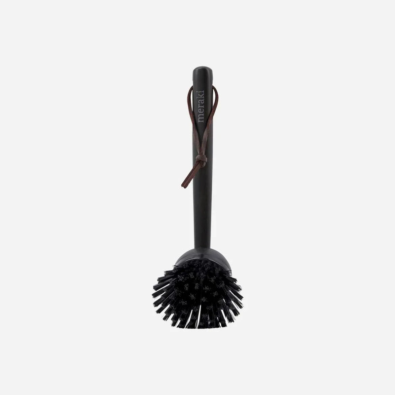 Meraki bamboo dish brush in black with leather hanging strap and replaceable brush head, a stylish sustainable swap for the kitchen sink