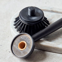 Detail of the replaceable brush head and twist-fit mechanism on the Meraki bamboo dish brush, designed to extend the life of the brush and reduce waste