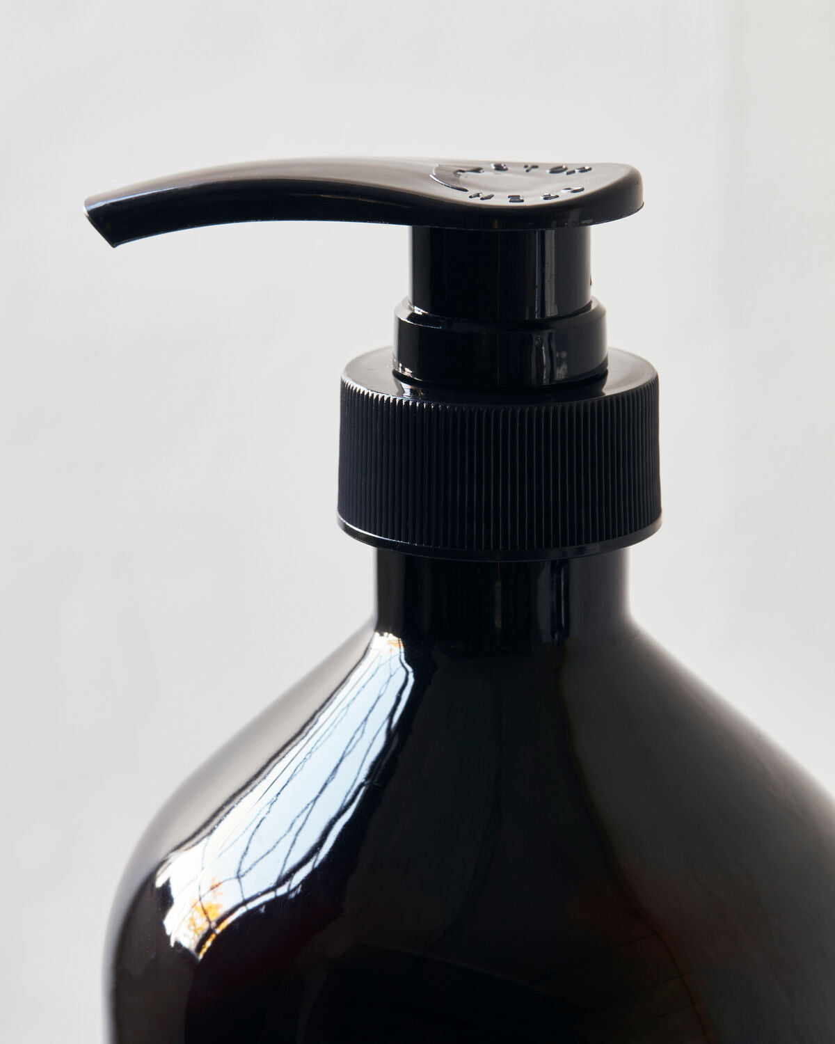 Meraki Herbal Nest dish wash bottle styled with glassware and linen