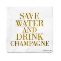 Lolly napkin with gold slogan, styled on a speckled plate with cutlery, festive table setting
