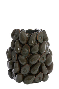 avocado vase styled on a dining table with candles and décor in a modern interior