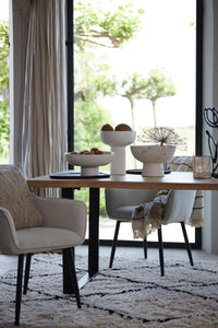 black wooden styling tray used under ceramic bowls in modern dining room
