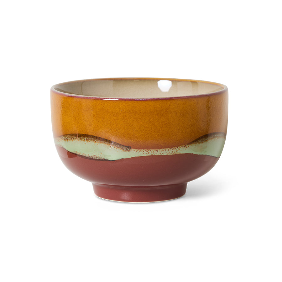 stoneware noodle bowl showing layered earthy glaze and rounded shape
