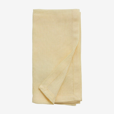 hand hemmed cloth yellow napkin folded neatly 
