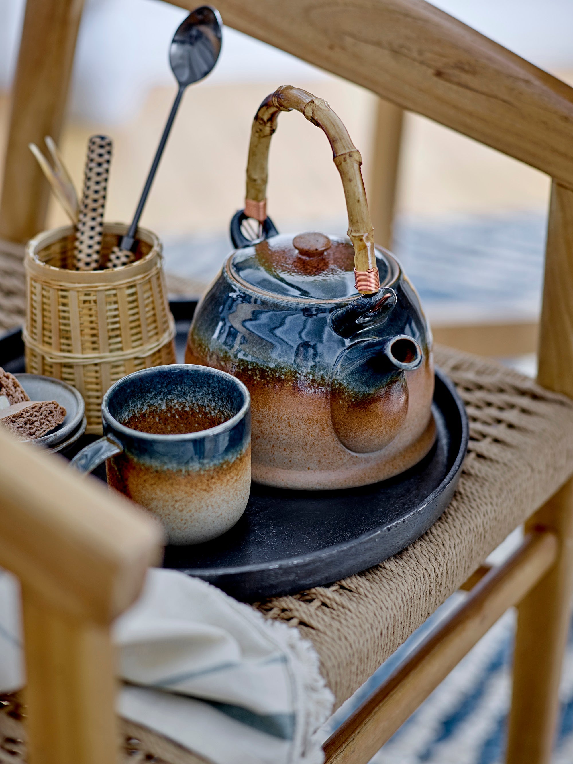 Aura blue and brown porcelain cup styled with matching teapot, Bloomingville
