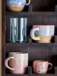 Louisa cup in rose pink stoneware, showing unique running glaze
