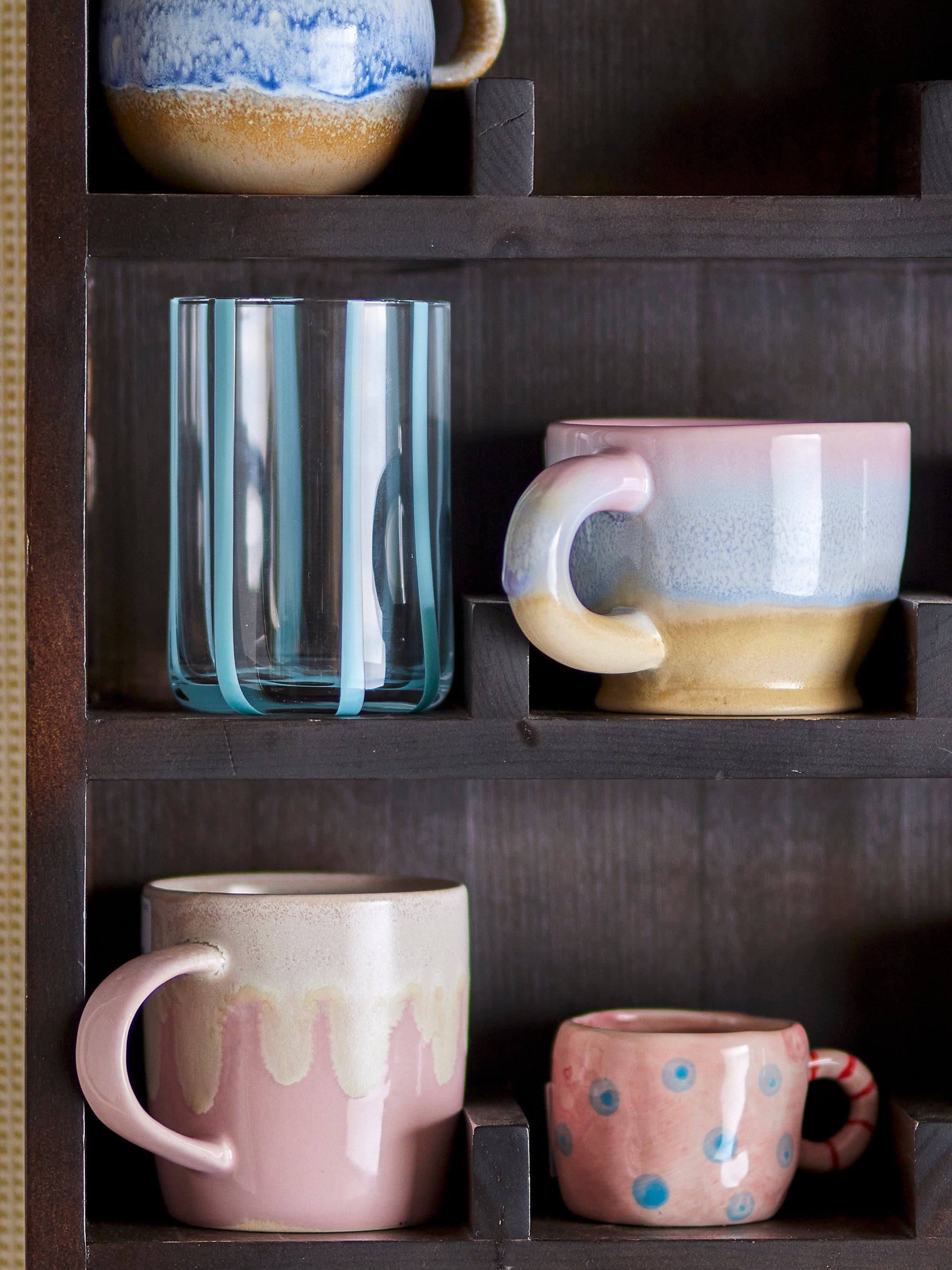 Louisa cup in rose pink stoneware, showing unique running glaze
