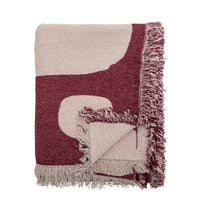 Olica burgundy throw folded showing pattern and fringed edge detail