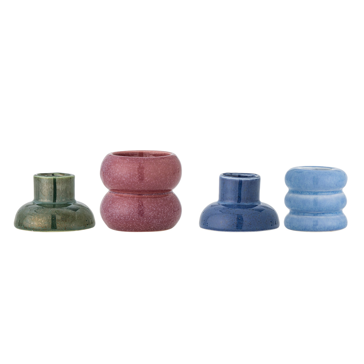Four separate Tana stoneware candle holders in dark green, dusty pink, navy and light blue lined up on a white background