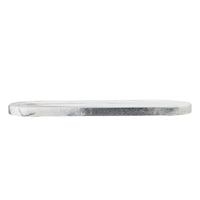 side view of grey marble cutting board showing thickness and polished stone edge
