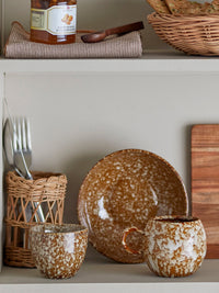 Paula brown reactive glaze cup stacked with matching stoneware bowl
