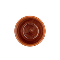 Check cup with warm red interior and checkered pattern, stoneware
