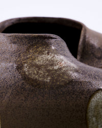 Close-up of the matte stoneware finish and irregular pinched opening on the House Doctor Expo vase, showing handmade ceramic craftsmanship