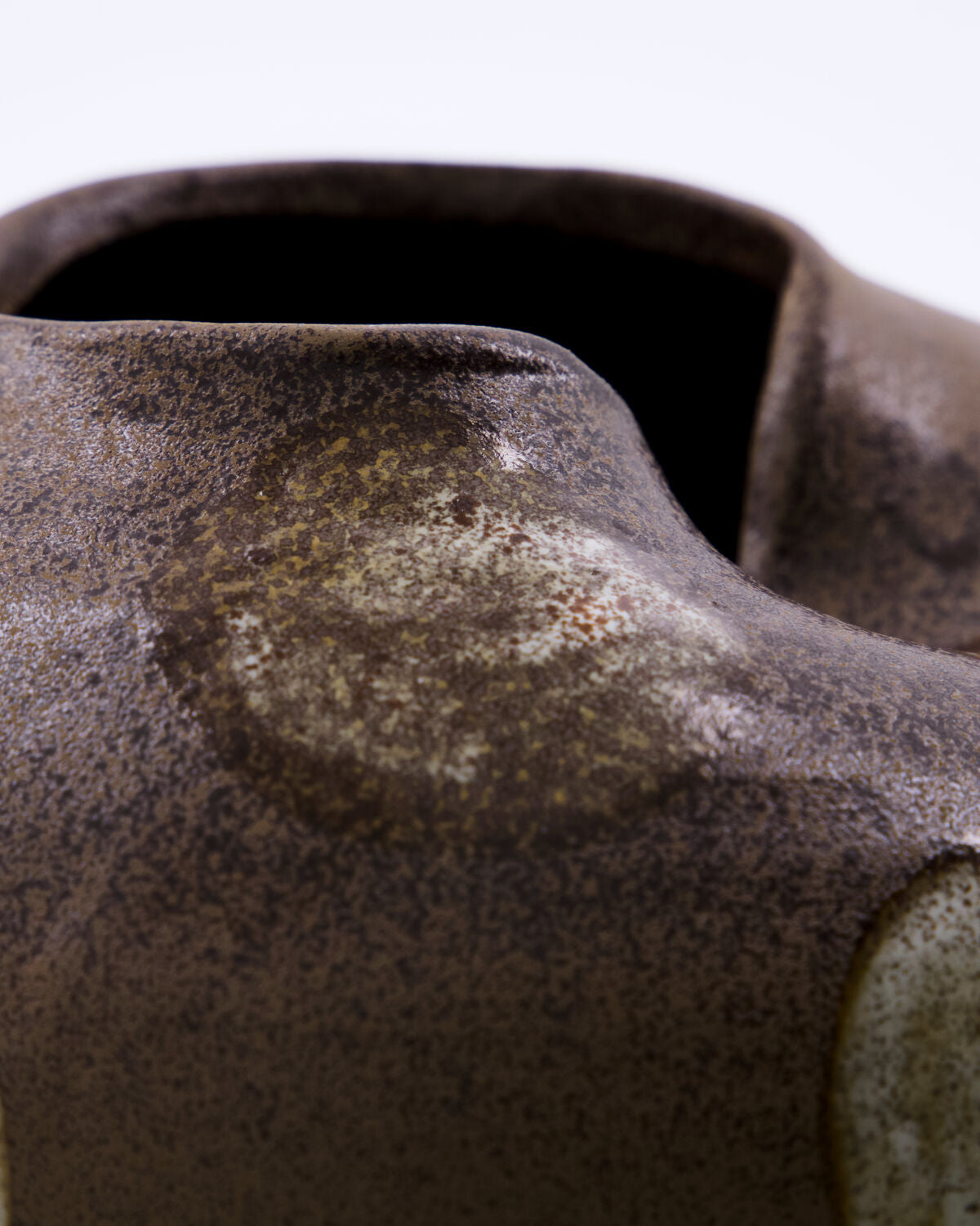 Close-up of the matte stoneware finish and irregular pinched opening on the House Doctor Expo vase, showing handmade ceramic craftsmanship