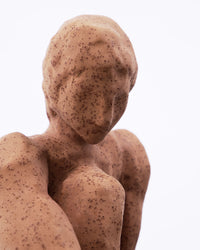 Close-up of the abstract face and shoulders of the House Doctor Woman sculpture in warm speckled stoneware, showing the handmade tactile finish
