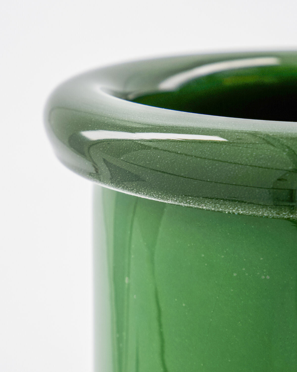 Close-up of the thick rolled rim and glossy emerald green glass on the House Doctor Buck vase, showing the handmade weight and quality
