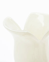 Close-up of House Doctor Cuff vase showing folded rim detail in off-white glass