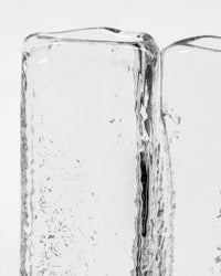 Close-up of the ruffled rim and glass texture of the House Doctor Zuri vase in clear glass