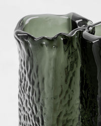 Close-up of the House Doctor Zuri vase's rim and ruffled glass texture in a rich, smoky Deep Forest green