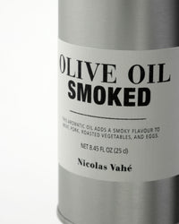 Close-up of Nicolas Vahé Smoked Olive Oil label on brushed aluminium tin