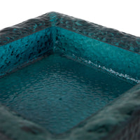 Teal sculptural square bowl in a styled interior