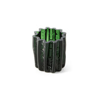 Emerald Corolla candle holder styled on a side table