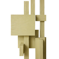 Close-up of the stacked pistachio-painted wooden blocks with visible grain