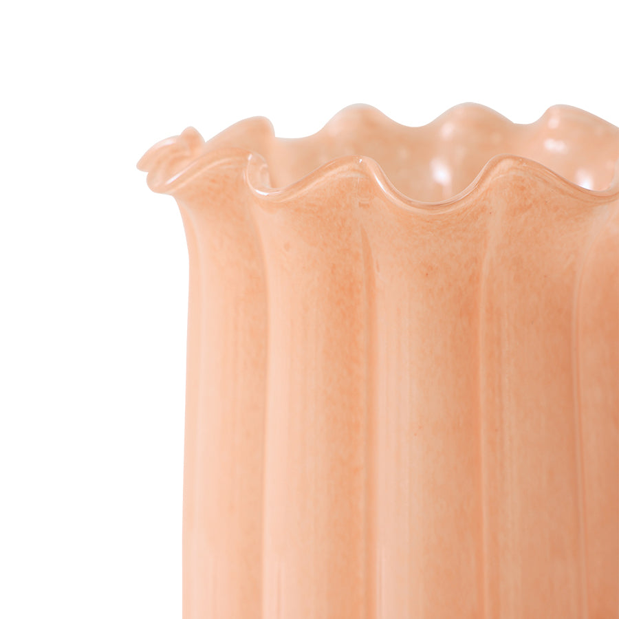 Close-up of the scalloped rim and ribbed texture of the peach glass vase by HKLIVING