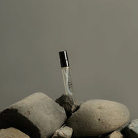 Fischersund JÓL mini fragrance spray displayed on natural stones