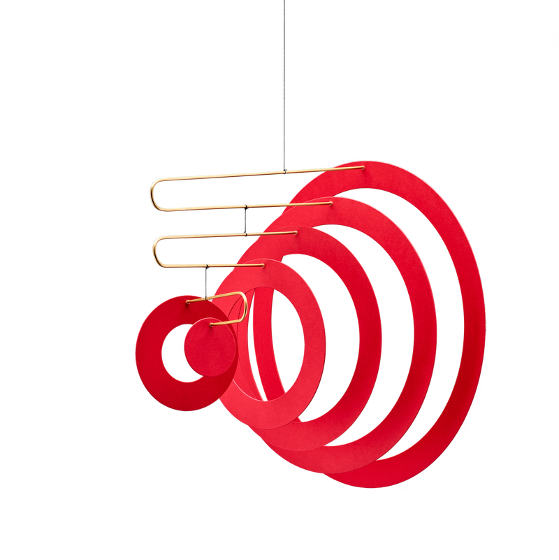 looking almost like rings making up the form of a megaphone a mobile by flensted handmade in denmark gives life and vibrancy to a space