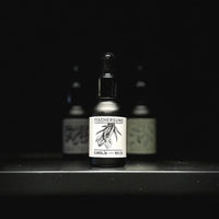 bottles of essential oil with dropper from icelandic fischersund fragrance this time the no.23 with images of herbs that have been handmade into this room fragrance