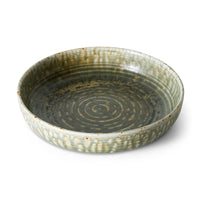 Large rustic green deep plate by HKLIVING at an angle, showing the ringed centre