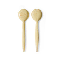 Angled view of the HKLIVING vanilla salad servers showing their long, tapered handles