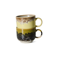 Set of two 70s ceramics tea mugs in Cravings by HKLIVING, stacked showing mustard-and-cream and olive-and-black speckled glazes