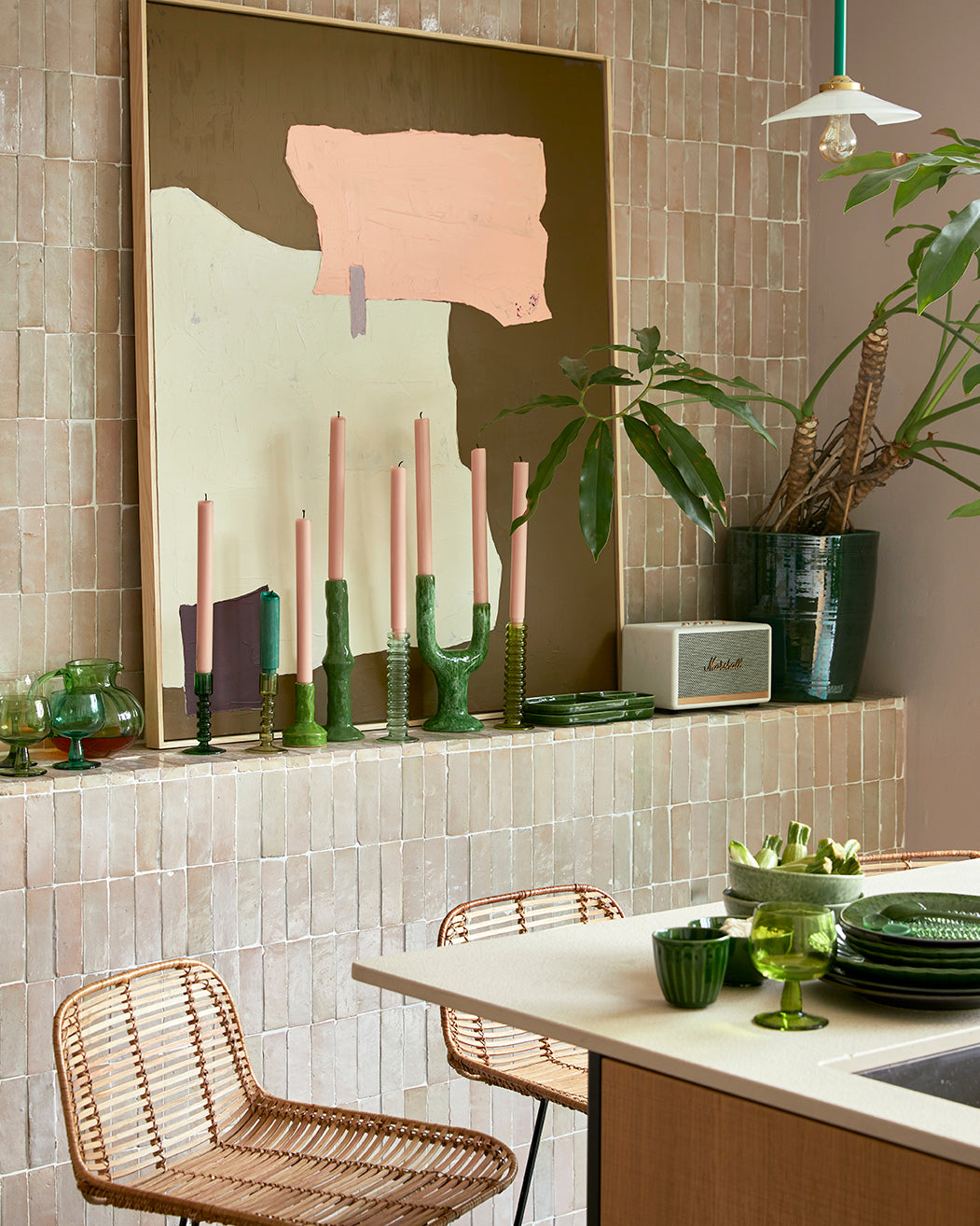 HKLIVING abstract painting in mustard brown, cream and peach hung above a kitchen counter with plants and a rattan stool