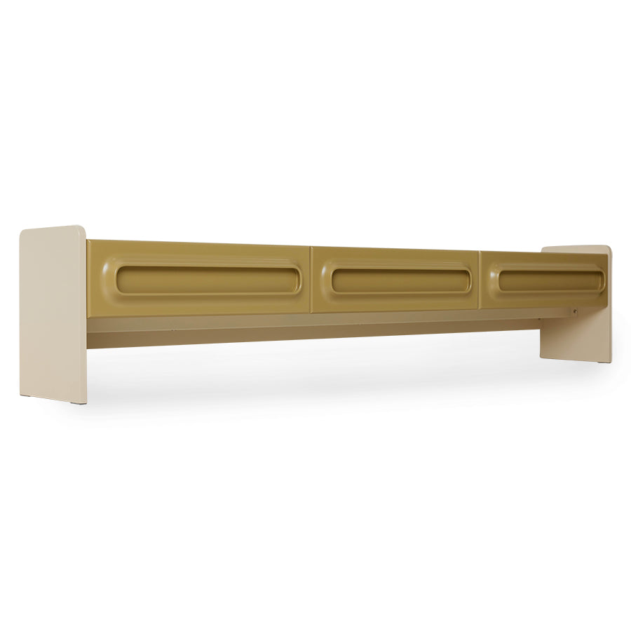 Angled detail of the olive-mustard drawer front and cream leg on the Space Lowboard by HKLIVING