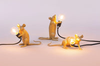 Seletti Gold Mouse Lamps in standing, sitting and lying down poses, lit up together
