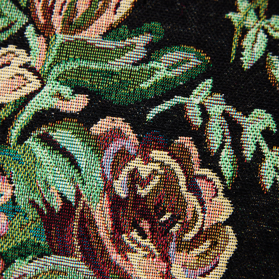 Woven Evening Bloom cushion in a styled interior