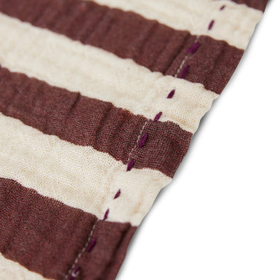 close up of burgundy and off creamy white striped cloth napkins from hk living