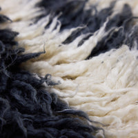 Organic Wool Rug in Black & Cream by HKLIVING – angled view showing woollen pile texture