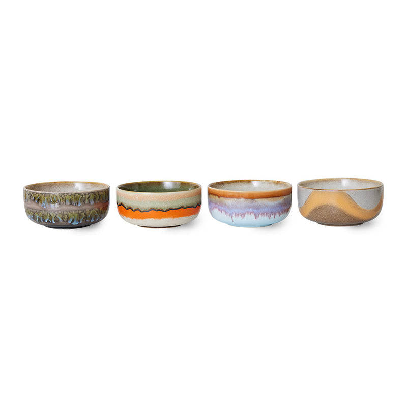 set of four hkliving reef dessert bowls in a row, showing green, orange, lilac and sandy dune glaze finishes
