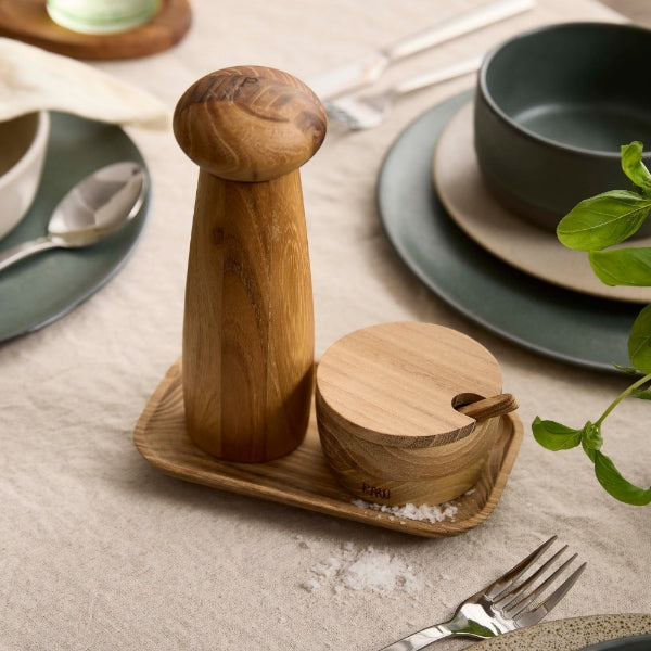 teak salt jar and pepper grinder set by aida on a tray for warm organised table styling
