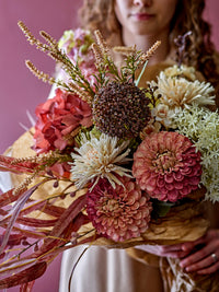 Artificial white allium stem in floral arrangement