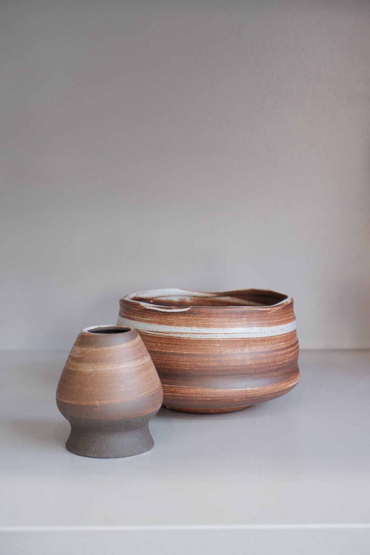 handmade auburn ceramic matcha bowl with finger grooves