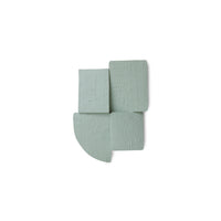 Sage green Levels wall sculpture on white background