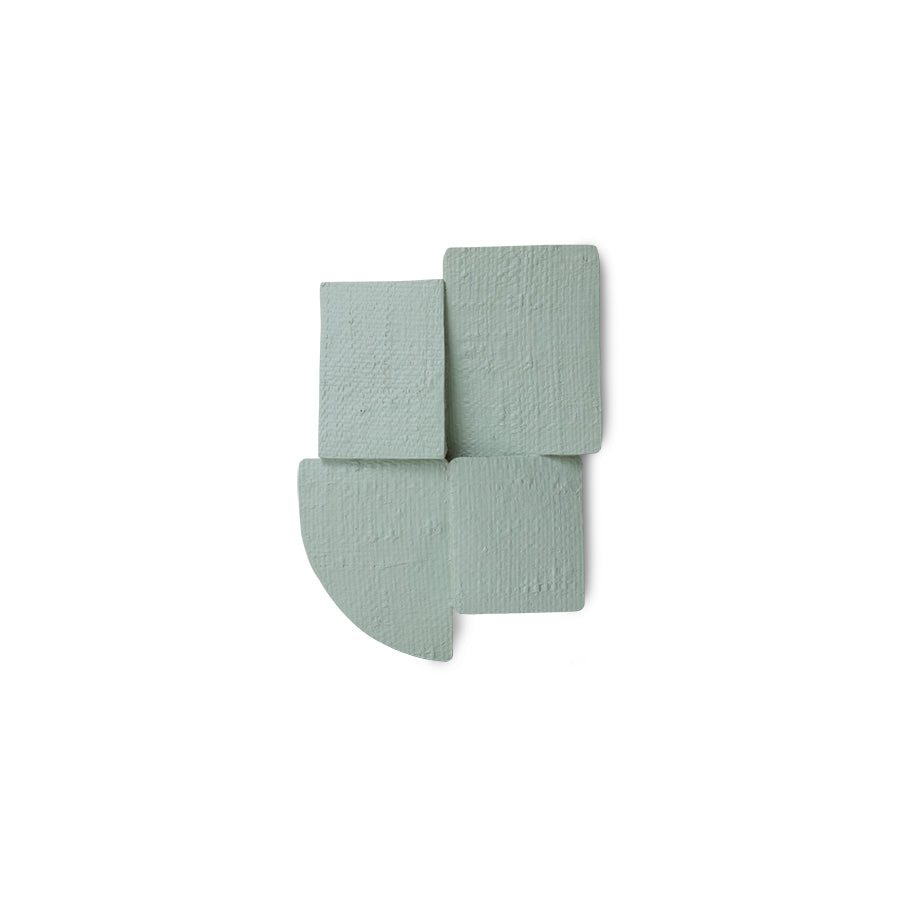 Sage green Levels wall sculpture on white background