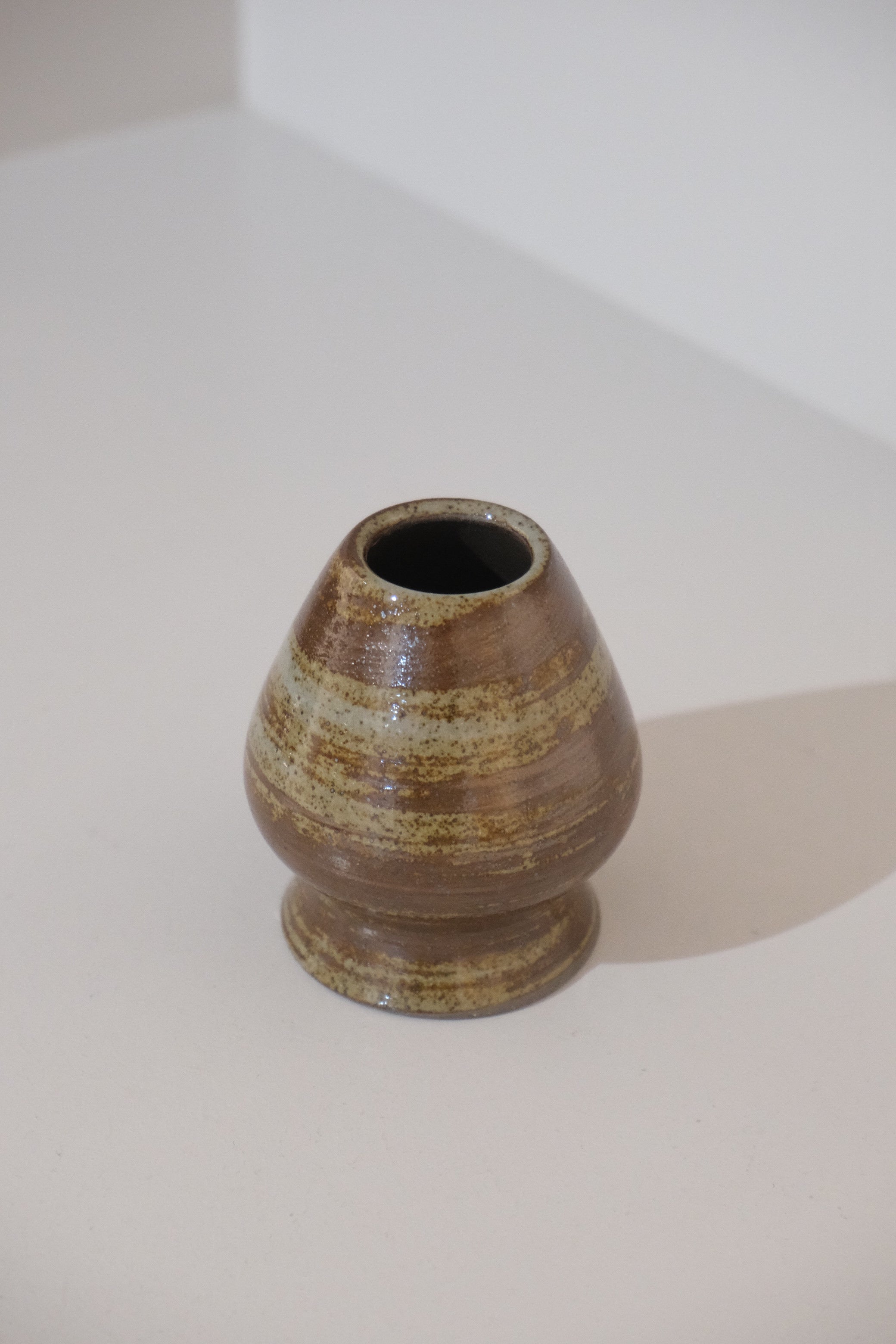 close up of bark ceramic kusenaoshi matcha whisk holder
