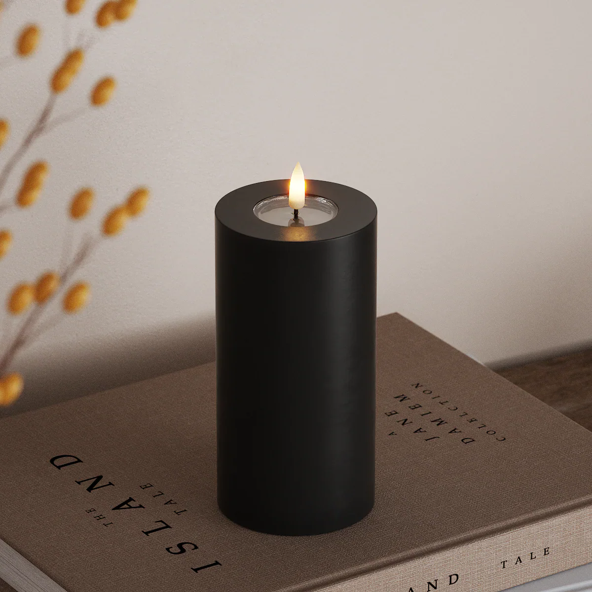 tall black LED pillar candle with lifelike flame creating warm autumnal ambience