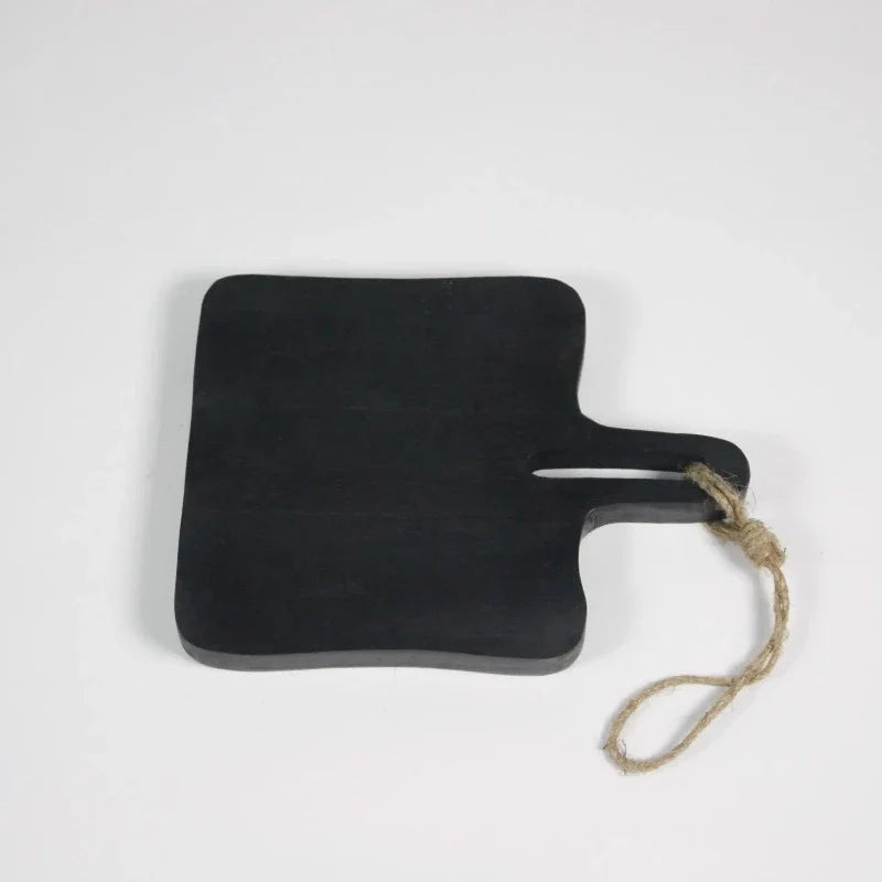 Medium black mango wood serving board with handle and jute loop by Olsson & Jensen