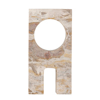 front view of the aoxi marble sculpture by bloomingville with circular cut out